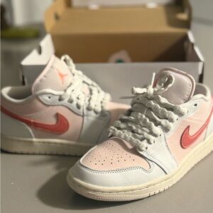 Air Jordan’s Low Summit White and Magic Ember Sneakers